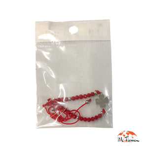 Pulsera roja con trébol